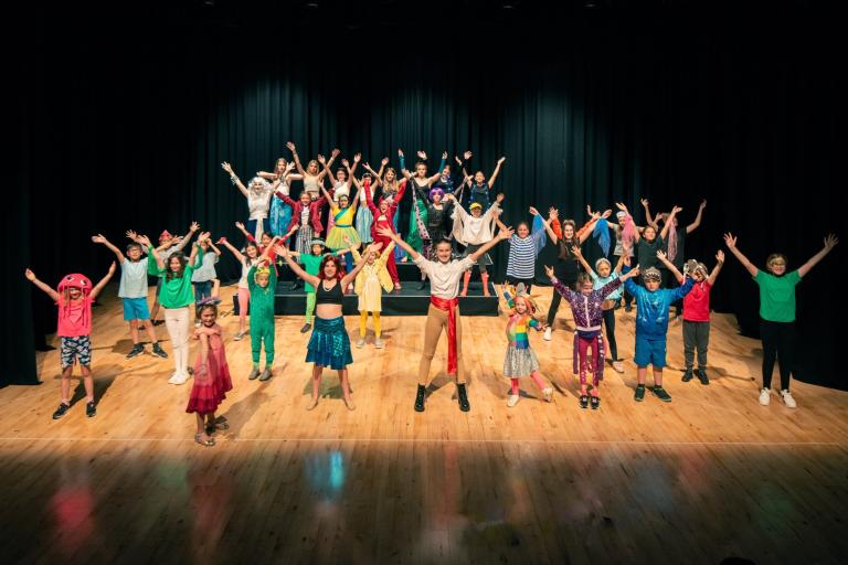 Children performing on a stage