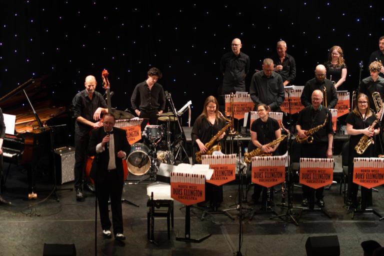 The North West Duke Ellington Orchestra performing on stage