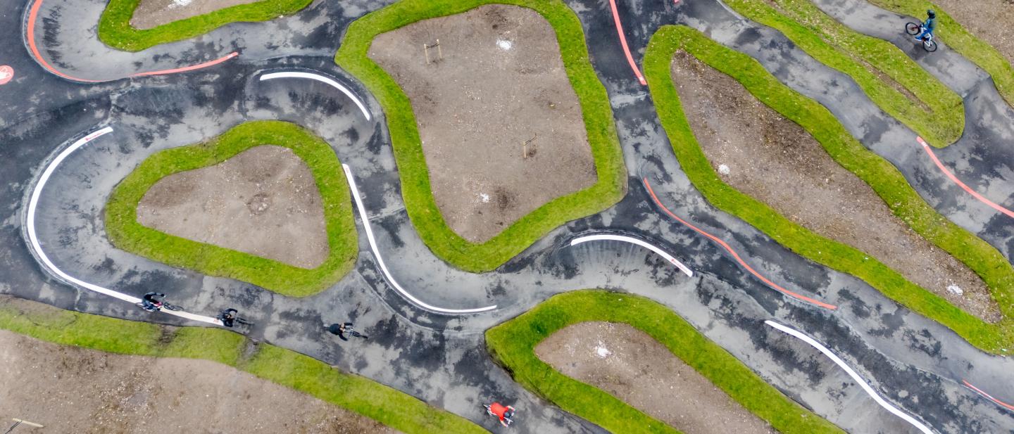 An aerial view of a BMX pump track 
