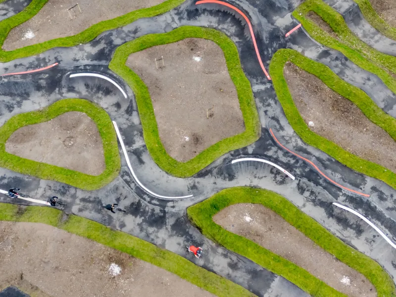 An aerial view of a BMX pump track 