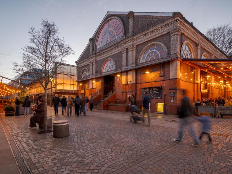 Altrincham Market in the evening people passing by