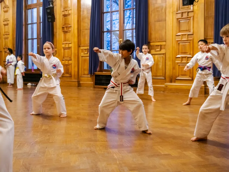 A group of children practicing Taekwondo