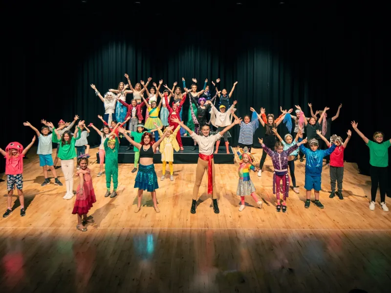 Children performing on a stage