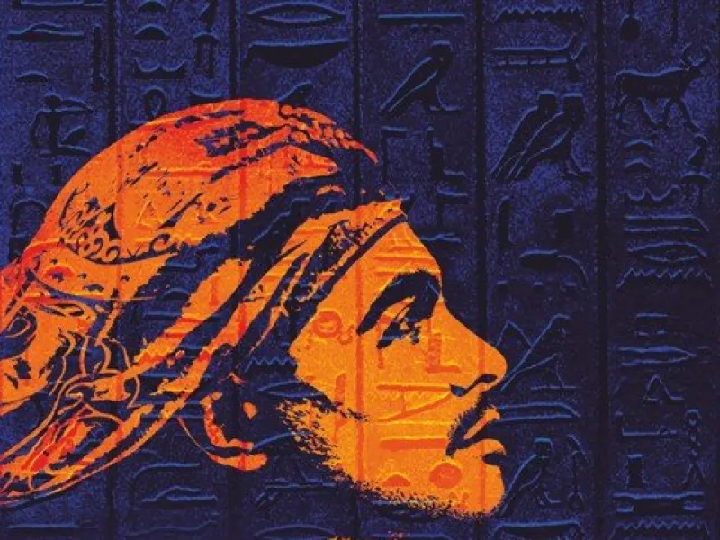 An orange stencil of a man's face in profile against an indigo background