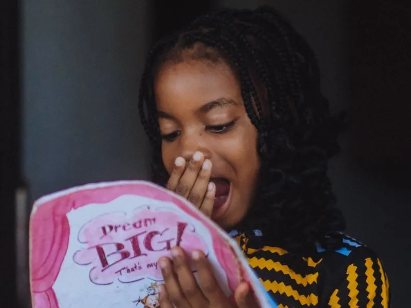 Surprised girl reading 