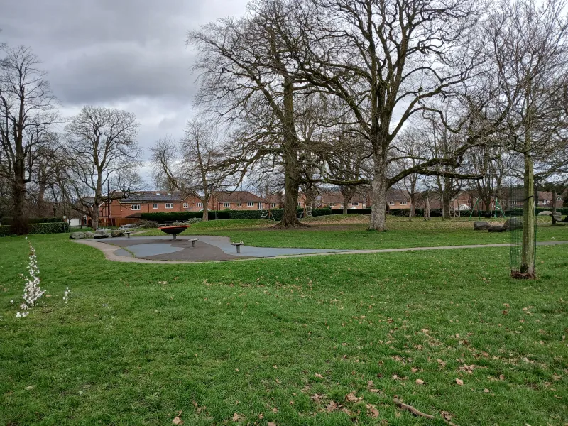 View across a park with bare trees
