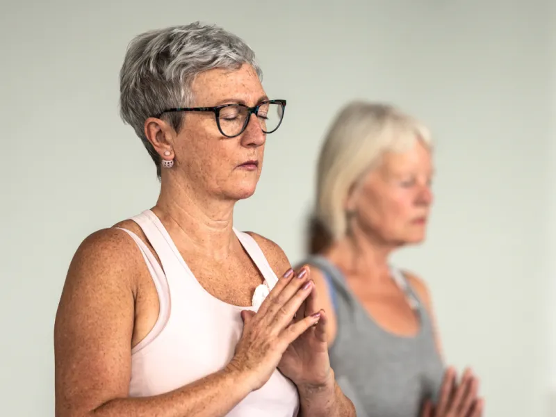 Two women doing yoga 