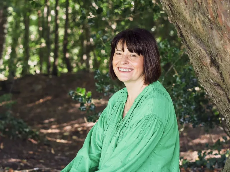 Woman sat beneath a tree 