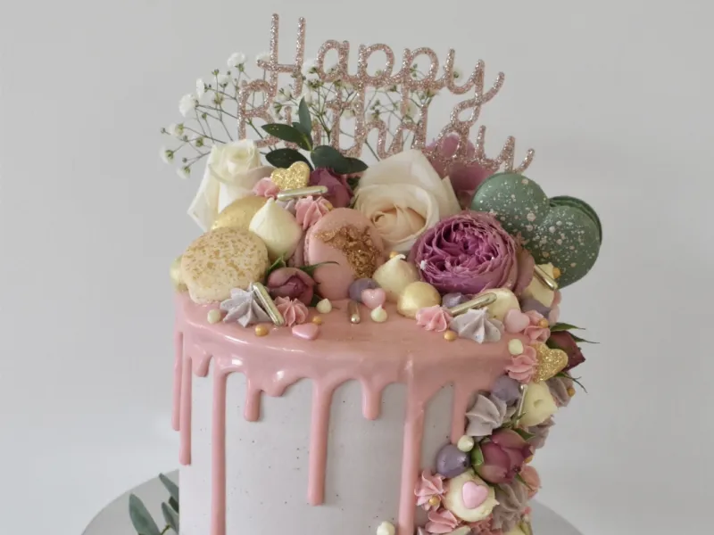 A cake with pink drip decoration
