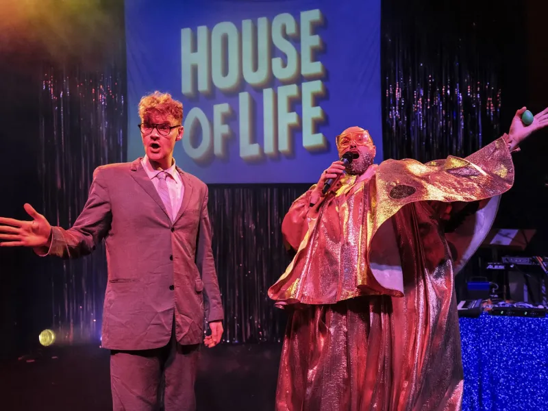 Two men performing on stage