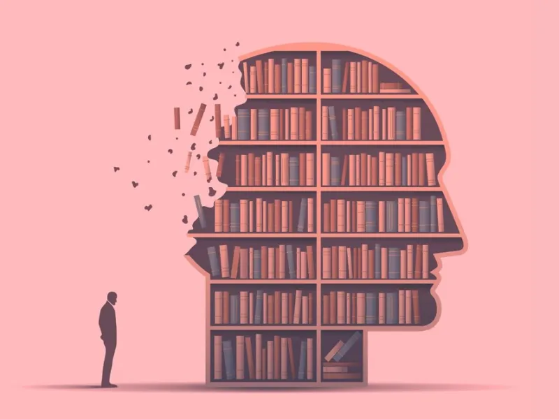 An illustration of a small man stood behind a giant head filled with shelves of books