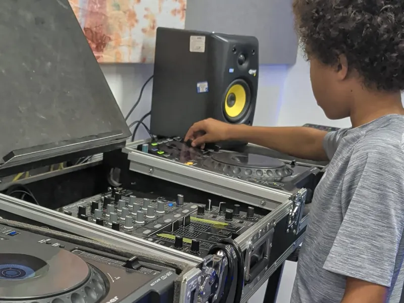 A child playing on DJ decks