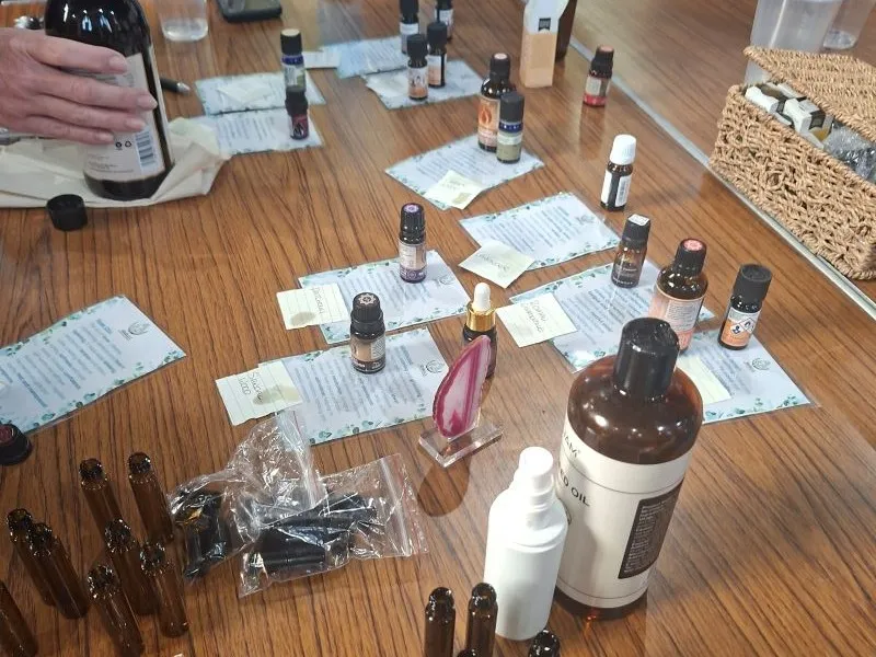 A table dotted with bottles of essential oils