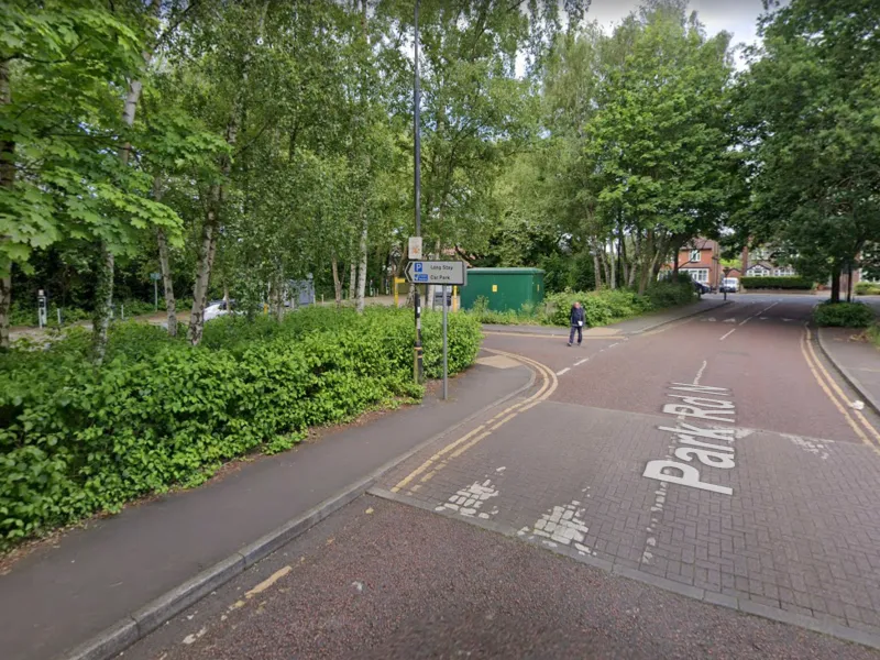 A streetview image of a road into a car park