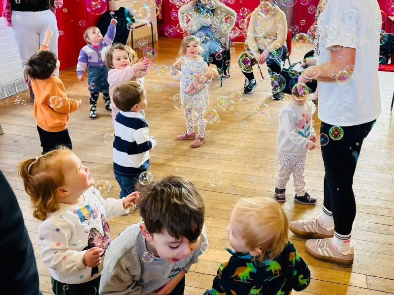 Children popping bubbles