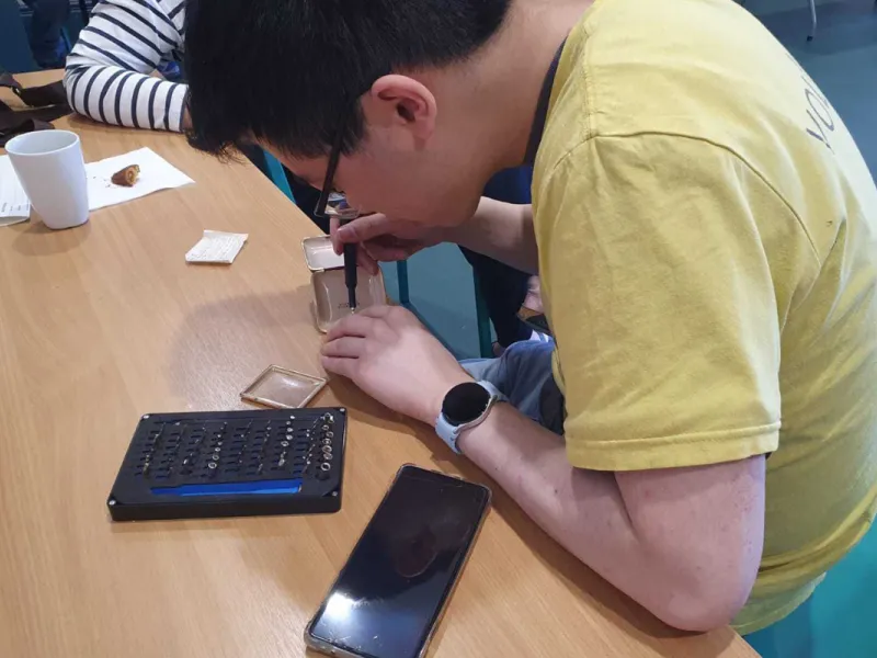 Someone repairing a gadget