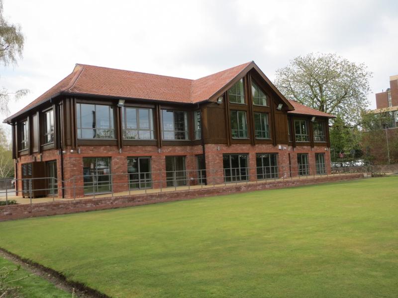 External library and pavilion building with bowling green in front