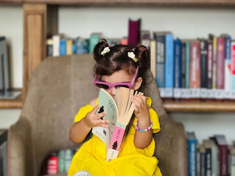 Little girl with big book!